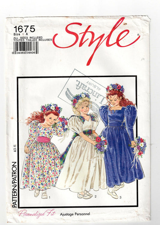 Style 1675
Vintage sewing pattern cover with three girls in dresses and floral headbands.