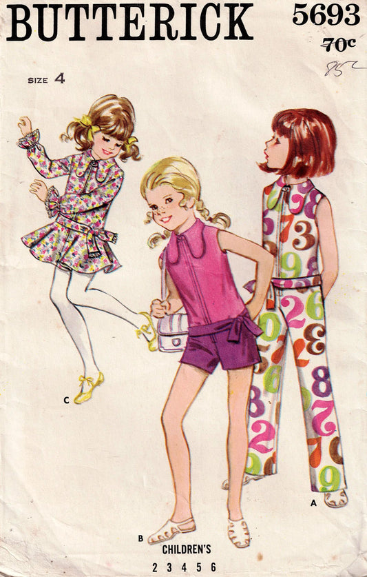 Butterick 5693
Butterick 5693 vintage children's fashion pattern with three girls modeling different outfits.