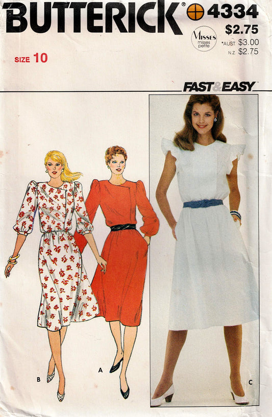 Butterick 4334 sewing pattern cover with three women wearing dresses and text.